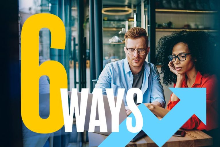 man and woman looking at a computer screen